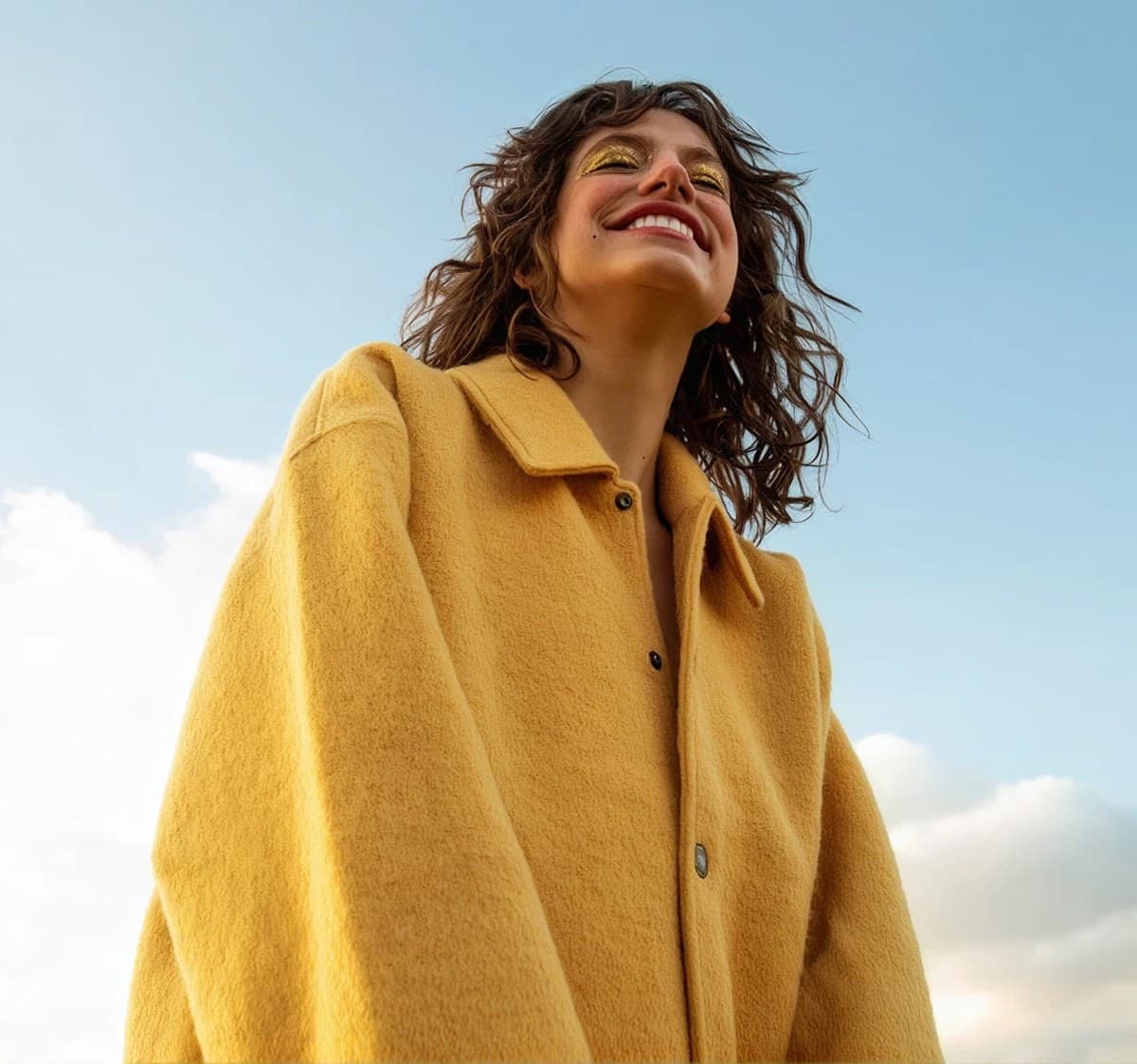 A person outdoors in warm sunlight. Payments that simply arrive.